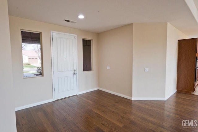 unfurnished room with dark hardwood / wood-style floors