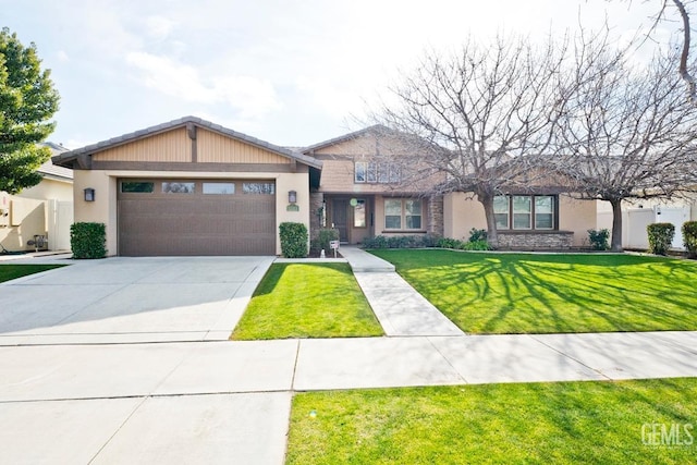 view of front of home with a garage and a front yard