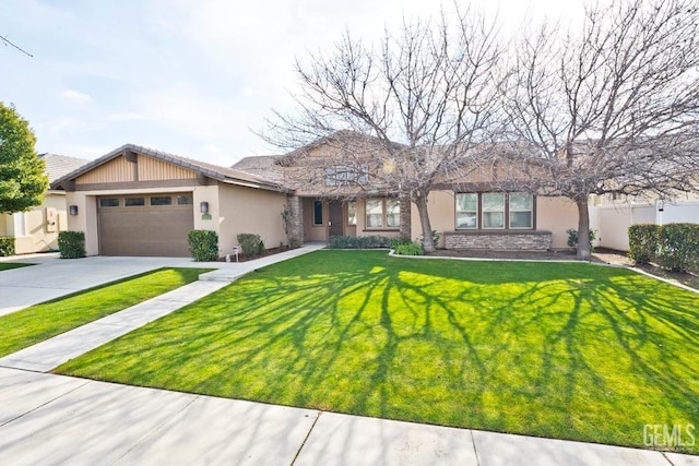 ranch-style house featuring a garage and a front lawn