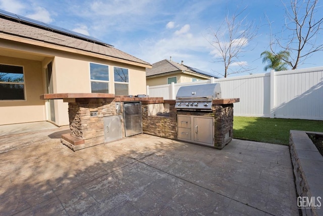 view of patio / terrace featuring area for grilling and a grill