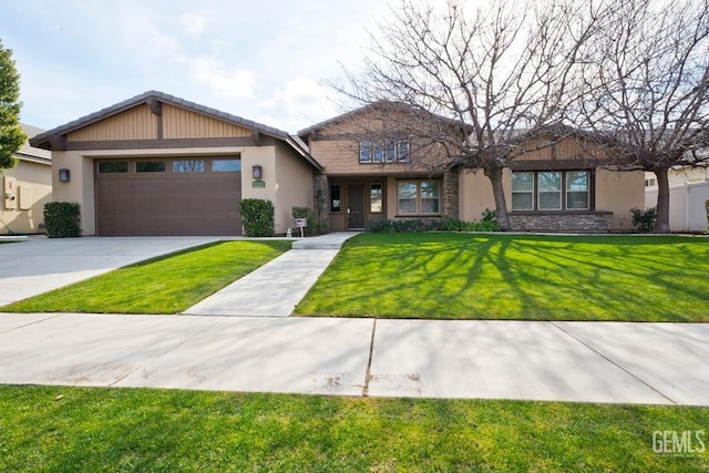 view of front facade featuring a garage and a front lawn