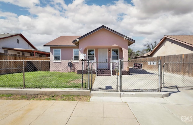 814 Eureka St, Bakersfield, CA 93305 - bungalow featuring a gate, a fenced front yard, covered porch, and stucco siding