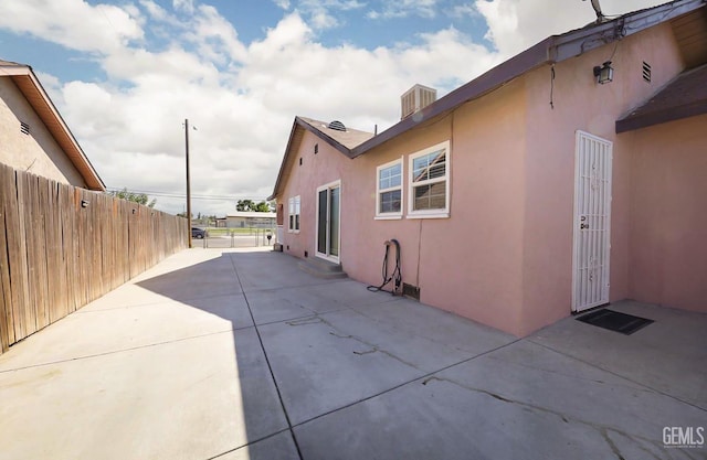 814 Eureka St, Bakersfield, CA 93305 - view of side of property featuring stucco siding and a patio