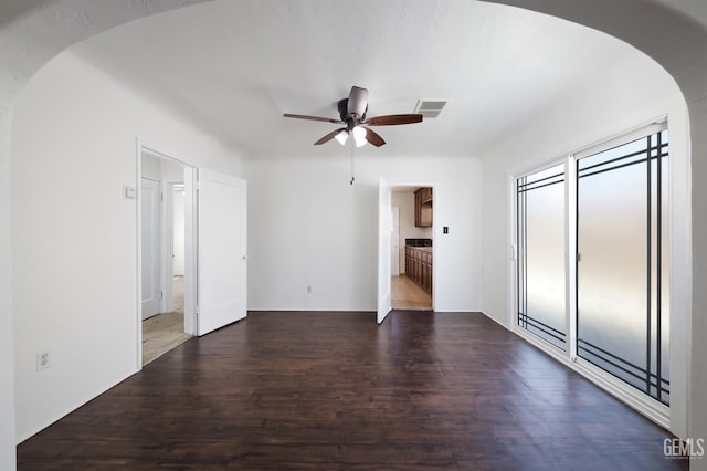 814 Eureka St, Bakersfield, CA 93305 - unfurnished bedroom with arched walkways, wood finished floors, ensuite bathroom, and a ceiling fan