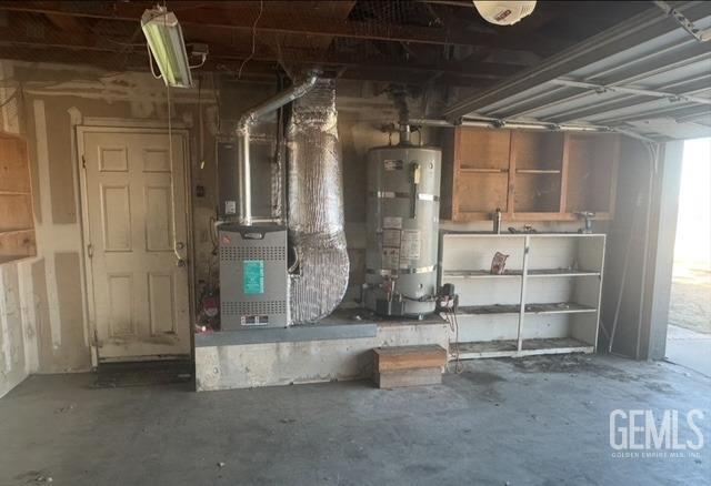 utility room with secured water heater and heating unit