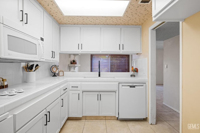 3504 Elm St, Bakersfield, CA 93301 - kitchen with white appliances, tile counters, a sink, and backsplash