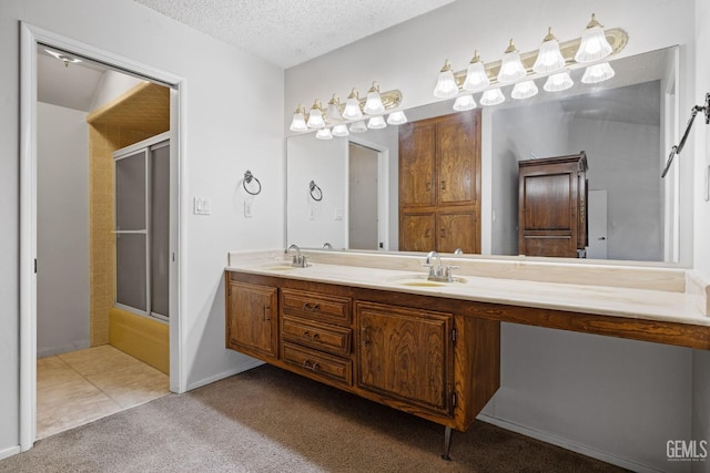 3504 Elm St, Bakersfield, CA 93301 - full bath with carpet flooring, a textured ceiling, and double vanity