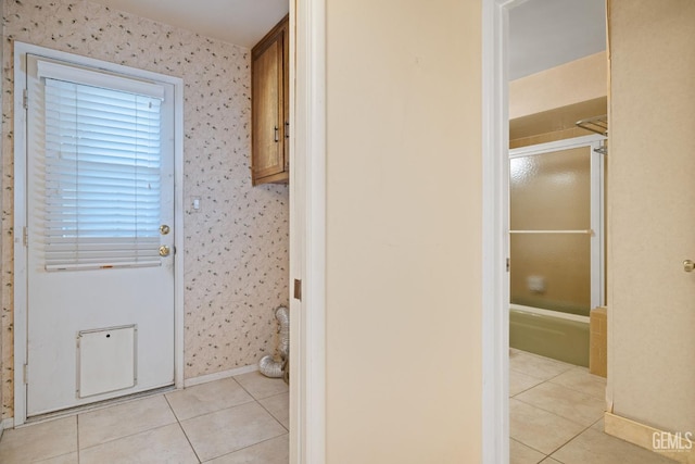 3504 Elm St, Bakersfield, CA 93301 - laundry room with light tile patterned floors, wallpapered walls, and baseboards