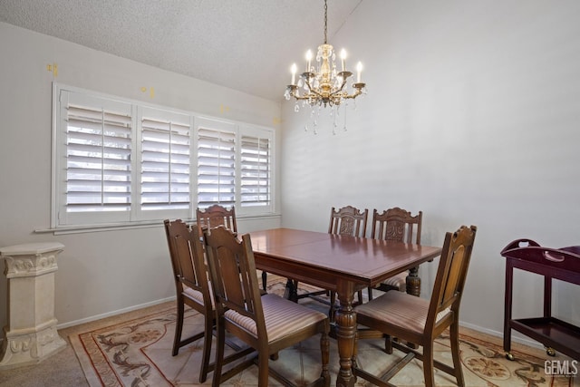3504 Elm St, Bakersfield, CA 93301 - dining room featuring a chandelier, baseboards, a textured ceiling, and vaulted ceiling