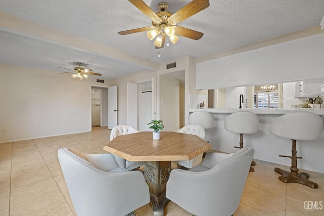 3504 Elm St, Bakersfield, CA 93301 - dining space with light tile patterned floors, ceiling fan, a textured ceiling, a chandelier, and baseboards