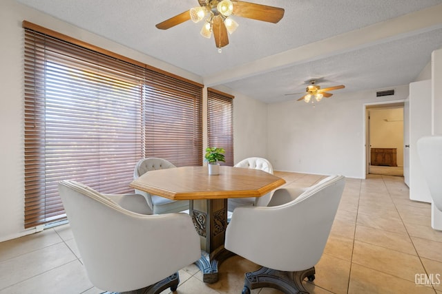 3504 Elm St, Bakersfield, CA 93301 - dining room with ceiling fan, light tile patterned floors, plenty of natural light, and a textured ceiling