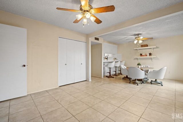 3504 Elm St, Bakersfield, CA 93301 - tiled dining area with ceiling fan and a textured ceiling