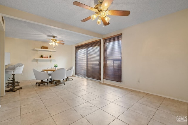 3504 Elm St, Bakersfield, CA 93301 - dining room with tile patterned floors, a textured ceiling, and a ceiling fan
