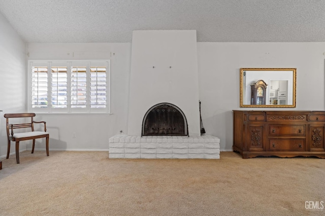 3504 Elm St, Bakersfield, CA 93301 - living room with a textured ceiling, carpet floors, a fireplace, and baseboards