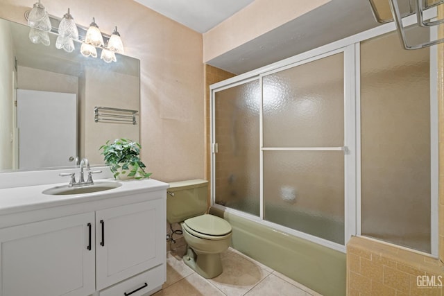 3504 Elm St, Bakersfield, CA 93301 - full bathroom featuring tile patterned floors, vanity, toilet, and combined bath / shower with glass door
