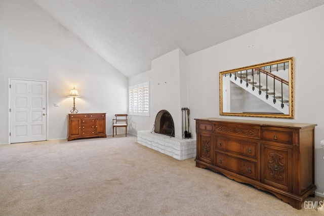 3504 Elm St, Bakersfield, CA 93301 - living area featuring light colored carpet, a textured ceiling, a brick fireplace, and high vaulted ceiling