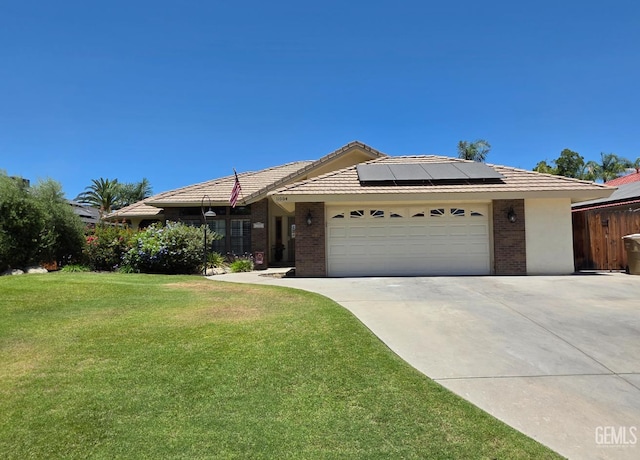11004 Dapple Way, Bakersfield, CA 93312 - ranch-style home with driveway, solar panels, a garage, and brick siding