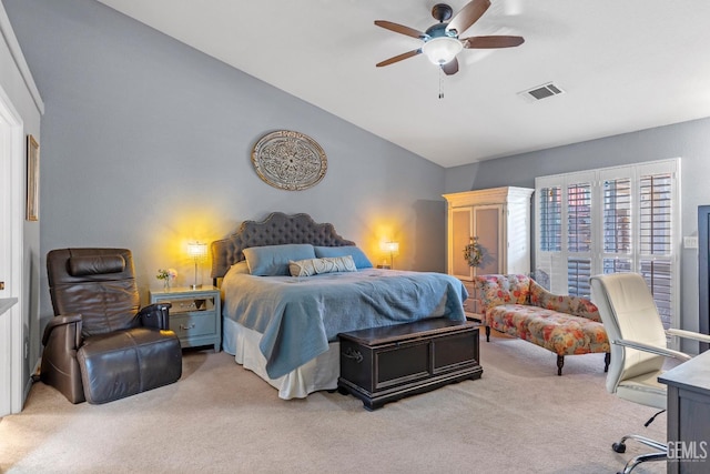 carpeted bedroom featuring ceiling fan and vaulted ceiling