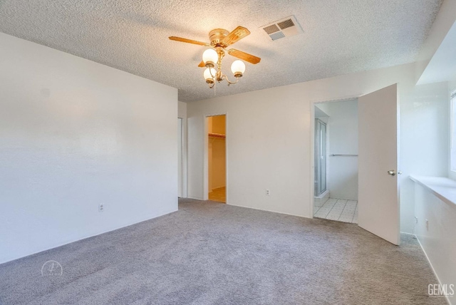 6201 Hartman Ave, Bakersfield, CA 93309 - carpeted empty room featuring a ceiling fan and a textured ceiling