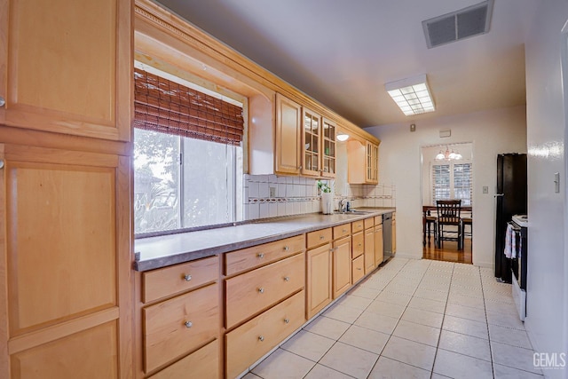 2849 Alturas Dr, Bakersfield, CA 93305 - kitchen with light tile patterned floors, visible vents, light brown cabinets, and a sink