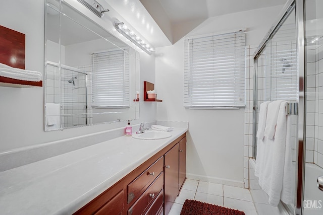 2849 Alturas Dr, Bakersfield, CA 93305 - bathroom with tile patterned floors, baseboards, vanity, and a tile shower