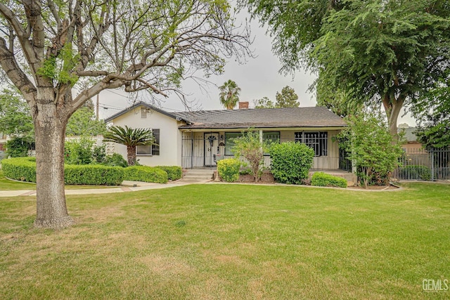 2849 Alturas Dr, Bakersfield, CA 93305 - ranch-style house featuring fence, a chimney, a front yard, and stucco siding