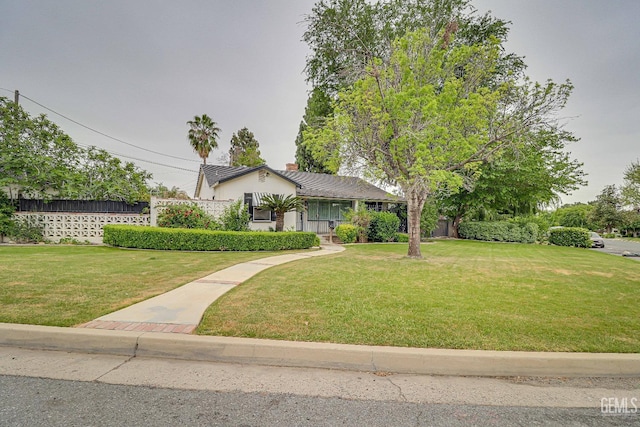 2849 Alturas Dr, Bakersfield, CA 93305 - view of front facade featuring stucco siding and a front yard