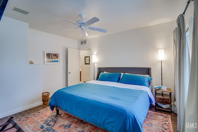 2849 Alturas Dr, Bakersfield, CA 93305 - bedroom with wood finished floors, visible vents, a ceiling fan, and baseboards