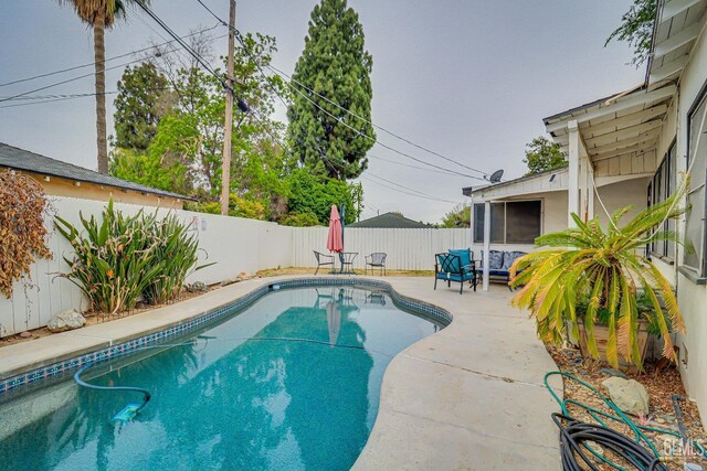 2849 Alturas Dr, Bakersfield, CA 93305 - view of swimming pool with a patio area, a fenced in pool, and a fenced backyard