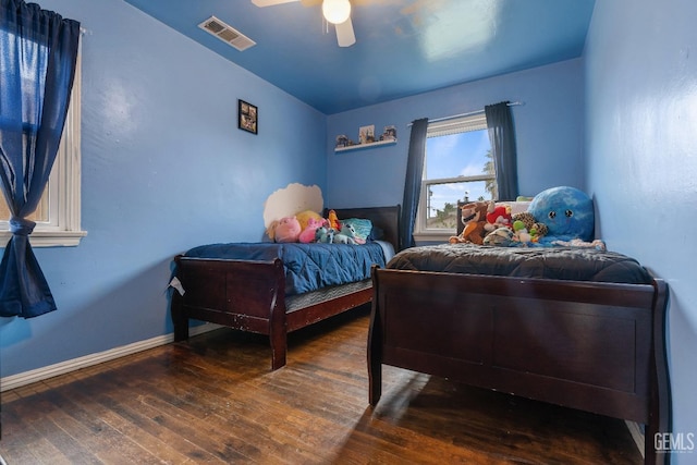 bedroom featuring ceiling fan and dark hardwood / wood-style flooring