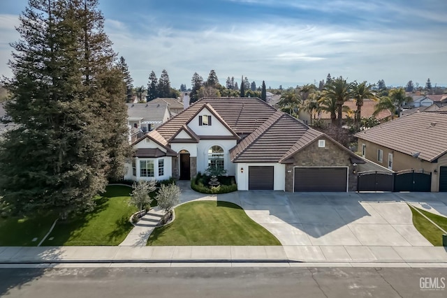 view of front facade with a garage and a front yard