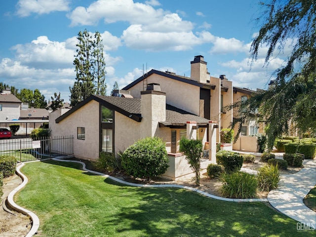 7800 Westfield Rd Unit 28, Bakersfield, CA 93309 - rear view of property with a chimney and stucco siding