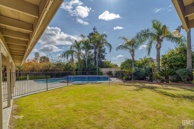 view of yard featuring fence and a fenced in pool