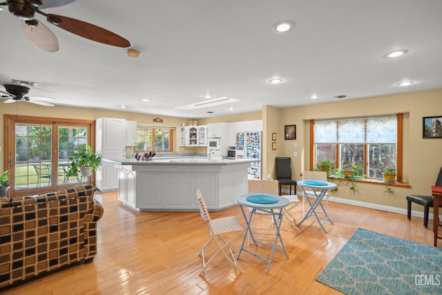 interior space featuring light wood finished floors, visible vents, and recessed lighting