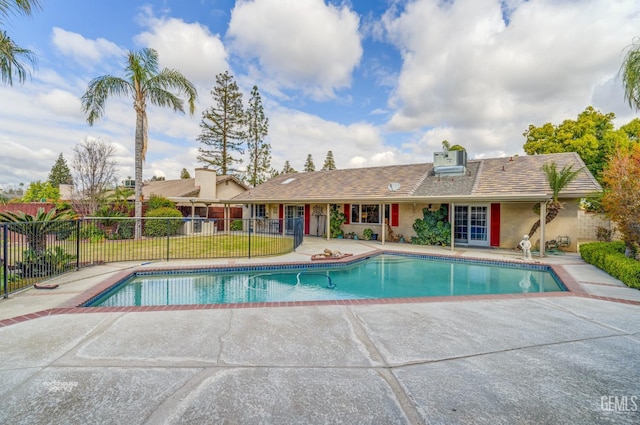 view of pool featuring a fenced in pool, a patio area, and fence