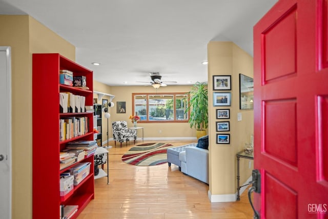 entryway featuring light wood-style floors, baseboards, a ceiling fan, and recessed lighting