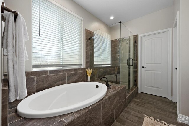 5503 Giverny Way, Bakersfield, CA 93306 - bathroom featuring a shower stall, a bath, plenty of natural light, and wood finished floors