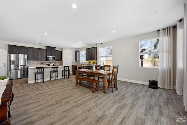 5503 Giverny Way, Bakersfield, CA 93306 - dining room featuring healthy amount of natural light, light wood-style floors, baseboards, and recessed lighting