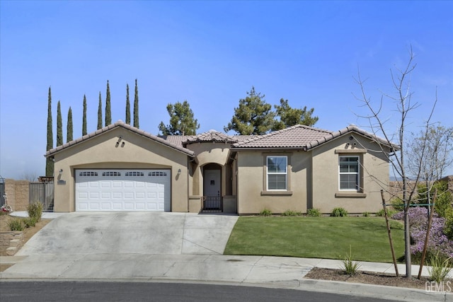 5503 Giverny Way, Bakersfield, CA 93306 - mediterranean / spanish house featuring a tile roof, stucco siding, a garage, concrete driveway, and a gate