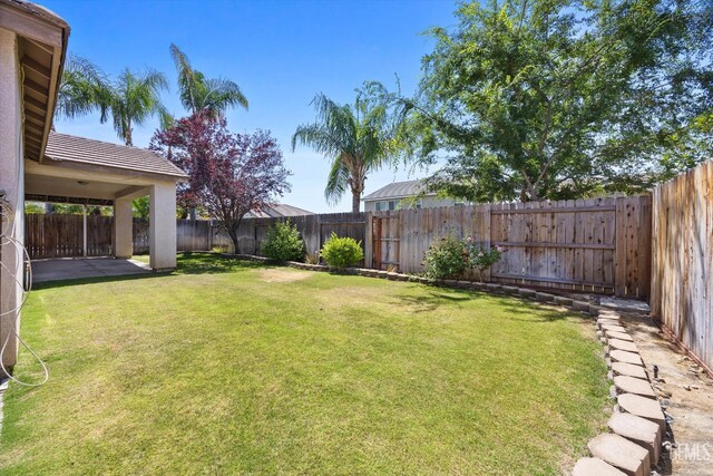 12415 Childress St, Bakersfield, CA 93312 - view of yard with a patio area