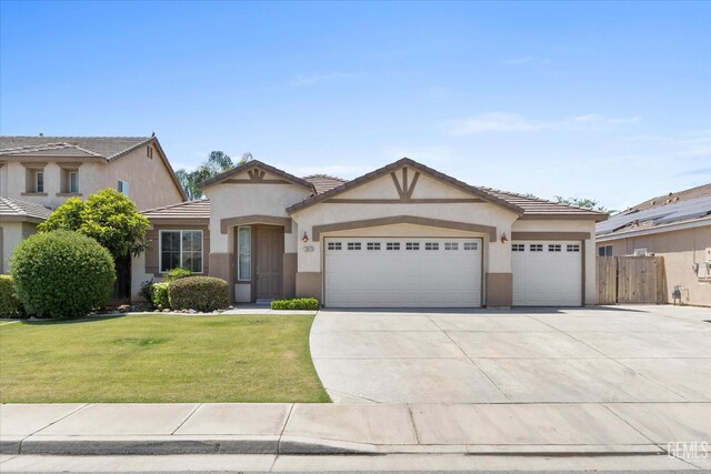 12415 Childress St, Bakersfield, CA 93312 - view of front of home with stucco siding, a garage, driveway, and a tile roof