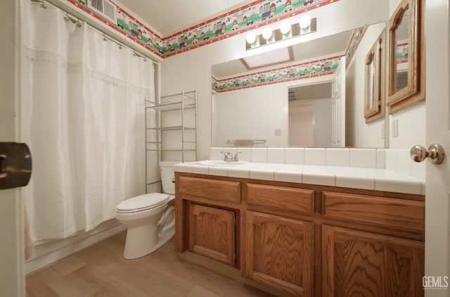 full bathroom with vanity, shower / bath combination with curtain, toilet, and wood-type flooring