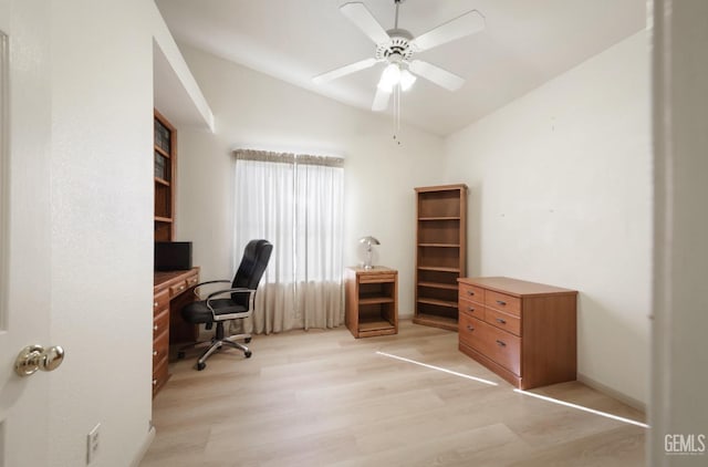 office with ceiling fan, light hardwood / wood-style flooring, and vaulted ceiling