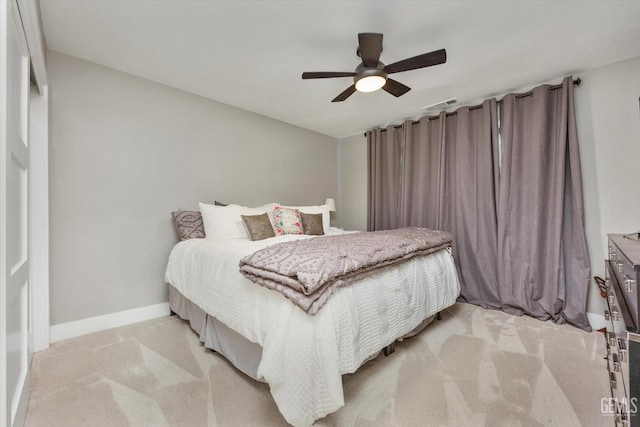 bedroom with light colored carpet and ceiling fan