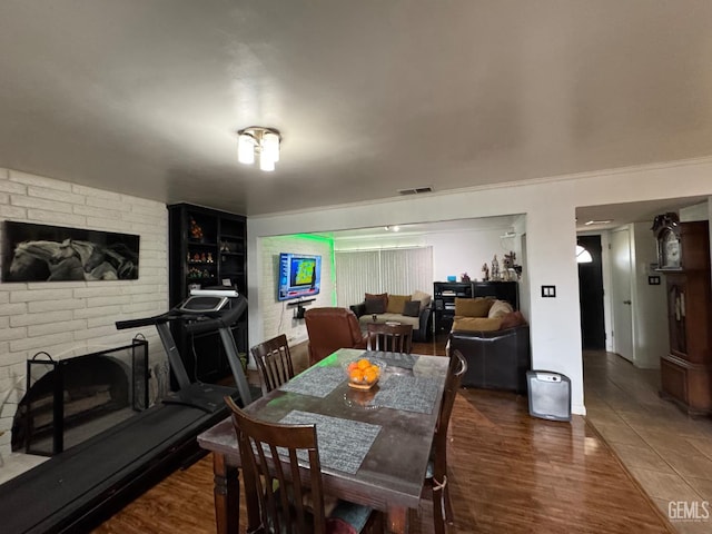 6301 Scenic Way, Bakersfield, CA 93309 - dining area featuring a fireplace and wood finished floors