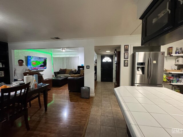 6301 Scenic Way, Bakersfield, CA 93309 - dining area with ornamental molding and dark tile patterned flooring