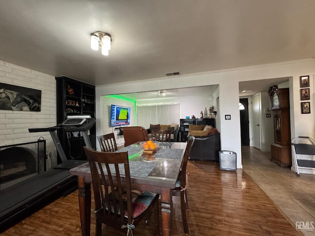 6301 Scenic Way, Bakersfield, CA 93309 - dining area with a fireplace and wood finished floors