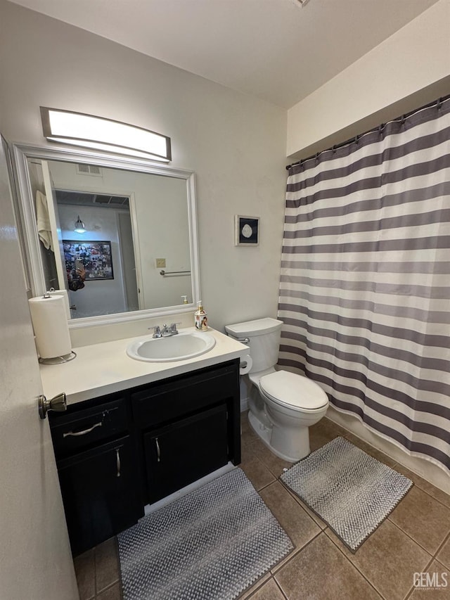 6301 Scenic Way, Bakersfield, CA 93309 - bathroom with tile patterned flooring, toilet, vanity, and a shower with curtain