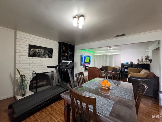 6301 Scenic Way, Bakersfield, CA 93309 - dining space with wood finished floors and a brick fireplace