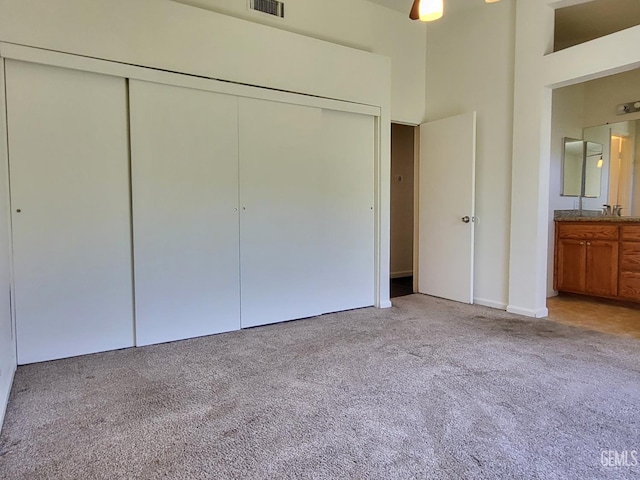 11511 Bay Meadows Ln, Bakersfield, CA 93312 - unfurnished bedroom with a closet, light carpet, connected bathroom, and a high ceiling
